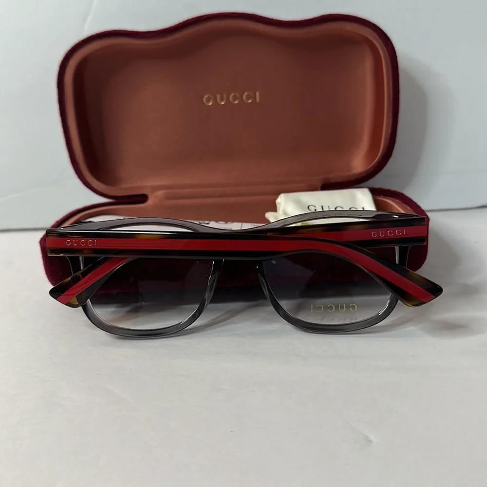 New- Auth - Gucci's GG0004ON soft lines across frames front.Iconic web effect…